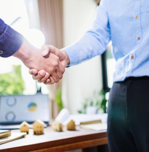 Real estate agent handshake, deal business. Business partnership meeting and home insurance